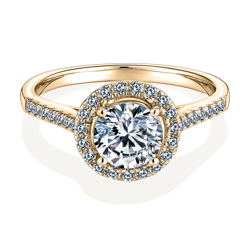 Round Brilliant halo engagement ring with 1.25 carats* of diamond simulants in 14 carat yellow gold