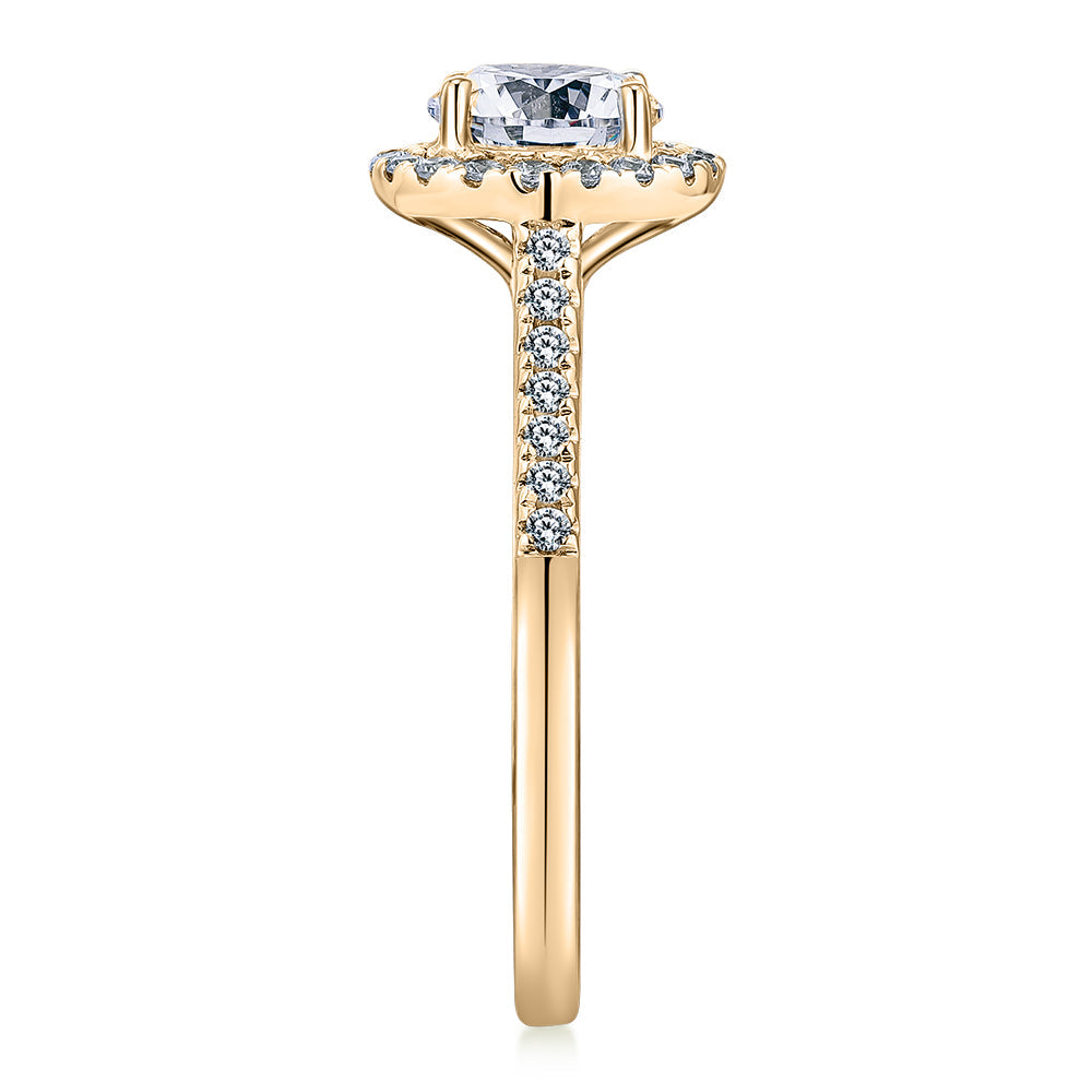 Round Brilliant halo engagement ring with 1.25 carats* of diamond simulants in 14 carat yellow gold