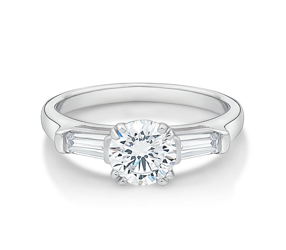 Round Brilliant and Baguette Cut Engagement Ring in White Gold