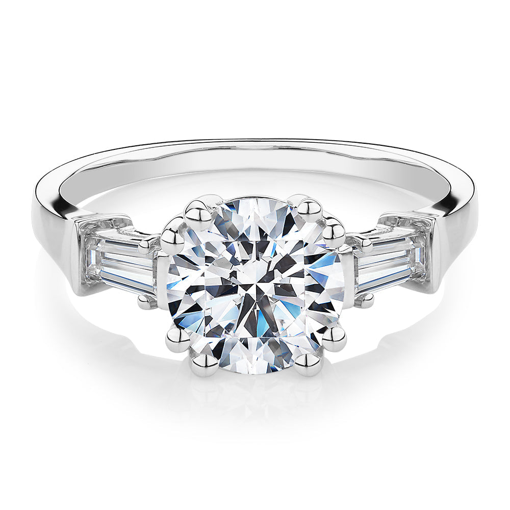 Round Brilliant and Baguette shouldered engagement ring with 2.46 carats* of diamond simulants in 10 carat white gold