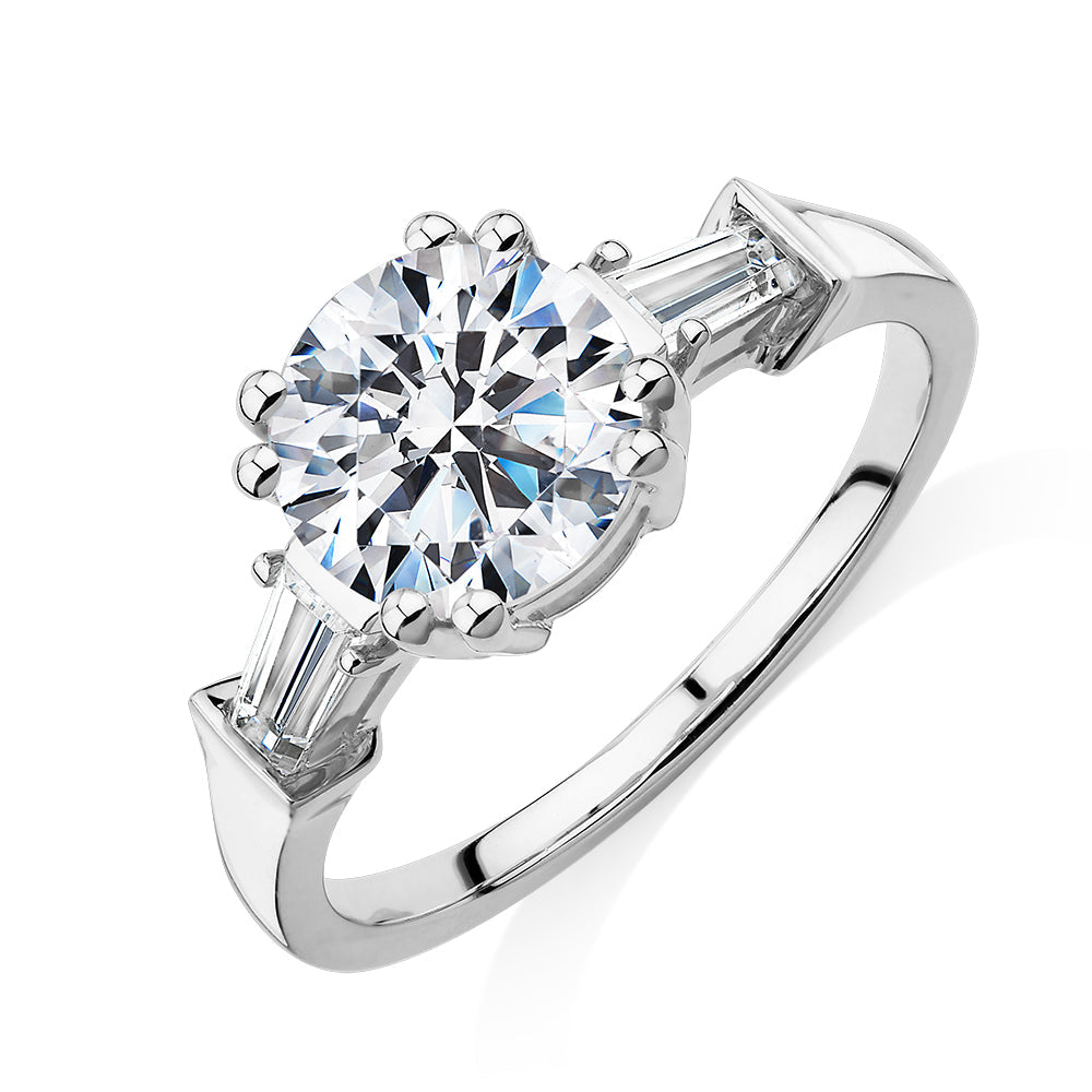 Round Brilliant and Baguette shouldered engagement ring with 2.46 carats* of diamond simulants in 10 carat white gold