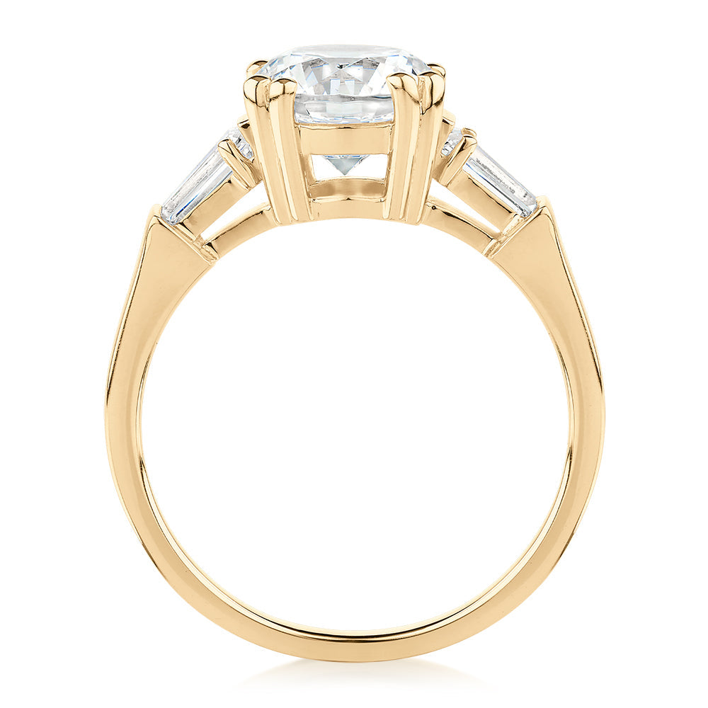 Round Brilliant and Baguette shouldered engagement ring with 2.46 carats* of diamond simulants in 10 carat yellow gold