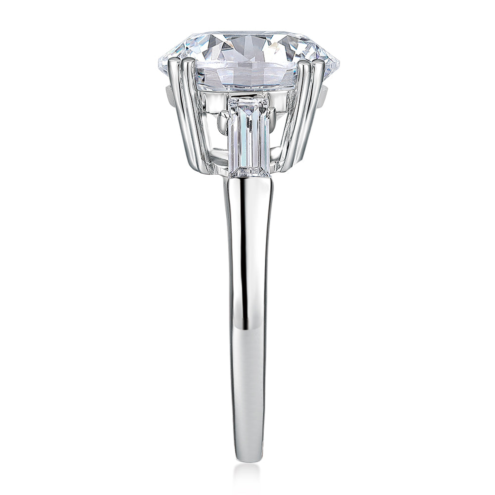 Round Brilliant and Baguette shouldered engagement ring with 5.33 carats* of diamond simulants in 10 carat white gold