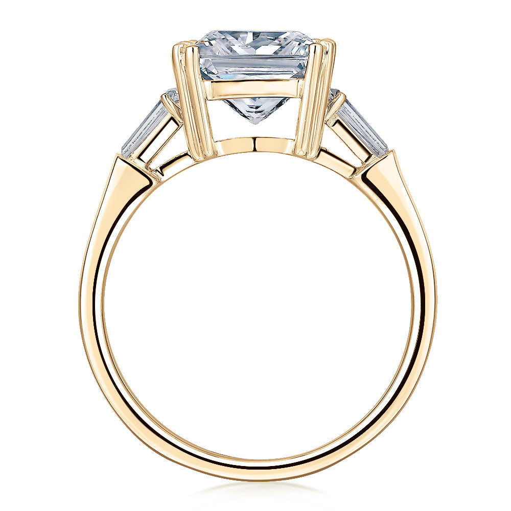 Princess Cut and Baguette shouldered engagement ring with 3.43 carats* of diamond simulants in 10 carat yellow gold