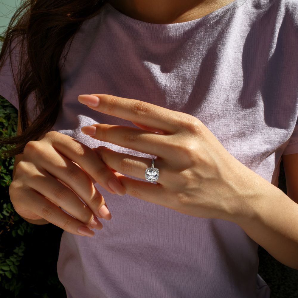 Cushion and Round Brilliant halo engagement ring with 1.91 carats* of diamond simulants in 14 carat white gold