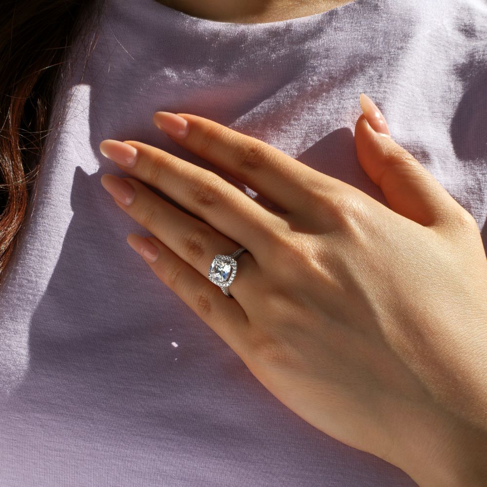 Cushion and Round Brilliant halo engagement ring with 1.91 carats* of diamond simulants in 14 carat white gold