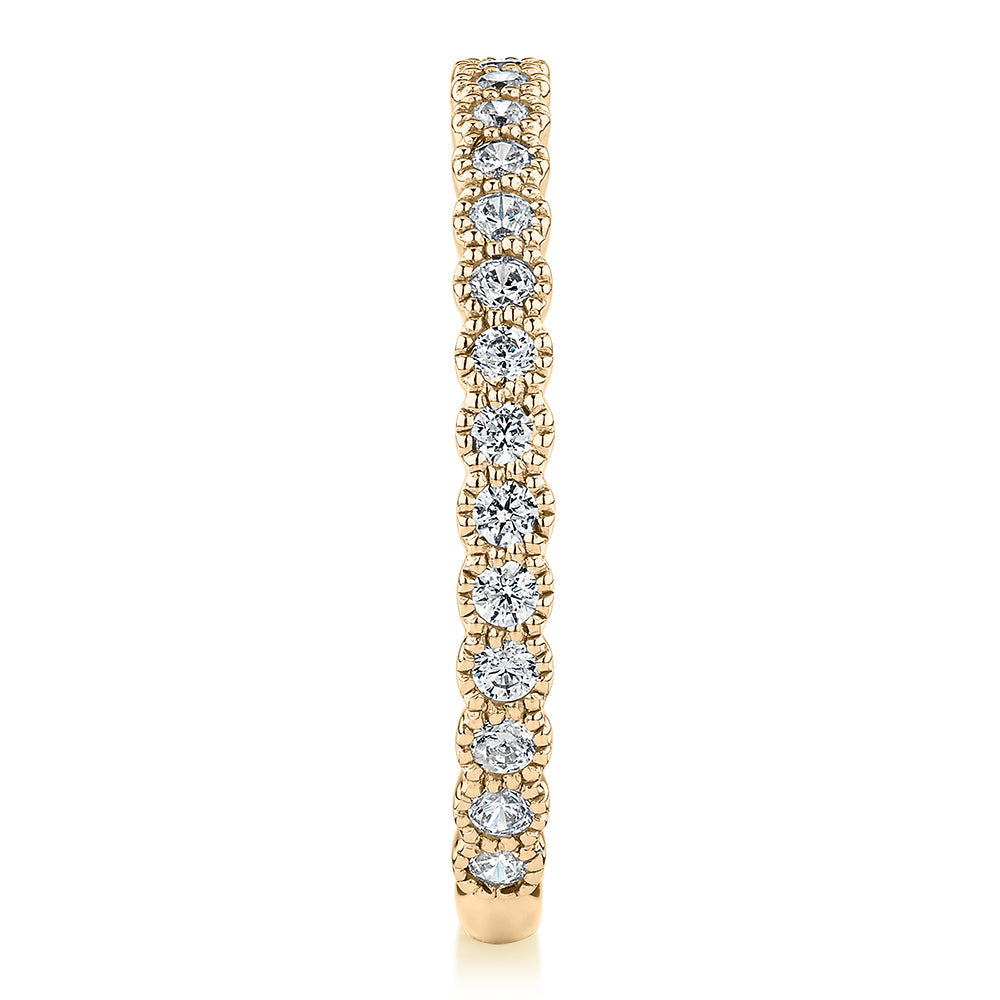 Wedding or eternity band with 0.4 carats* of diamond simulants in 10 carat yellow gold