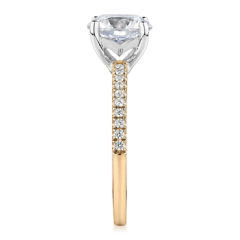 Round Brilliant shouldered engagement ring with 2.17 carats* of diamond simulants in 14 carat yellow and white gold