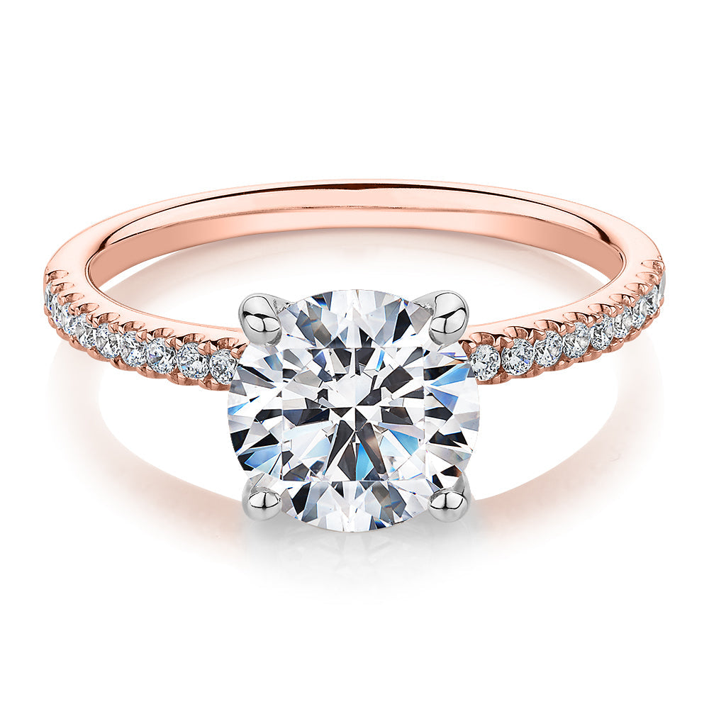 Round Brilliant shouldered engagement ring with 2.17 carats* of diamond simulants in 14 carat rose and white gold