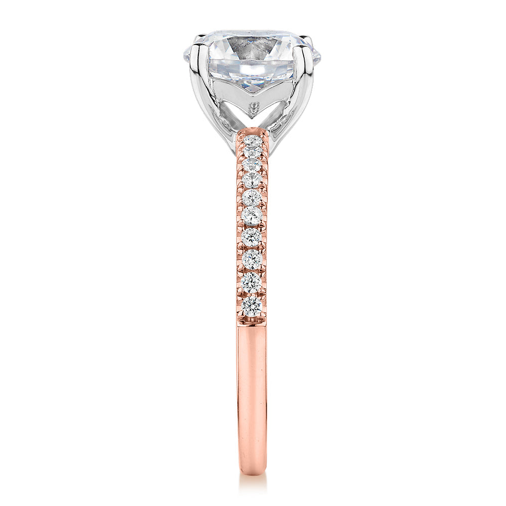 Round Brilliant shouldered engagement ring with 2.17 carats* of diamond simulants in 14 carat rose and white gold