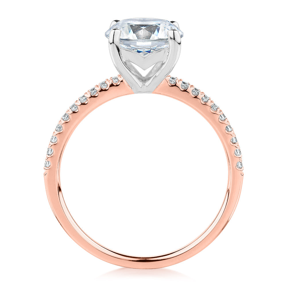 Round Brilliant shouldered engagement ring with 2.17 carats* of diamond simulants in 14 carat rose and white gold