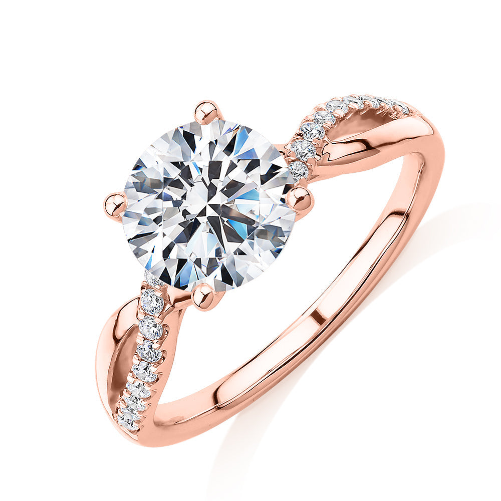Round Brilliant shouldered engagement ring with 2.17 carats* of diamond simulants in 14 carat rose gold