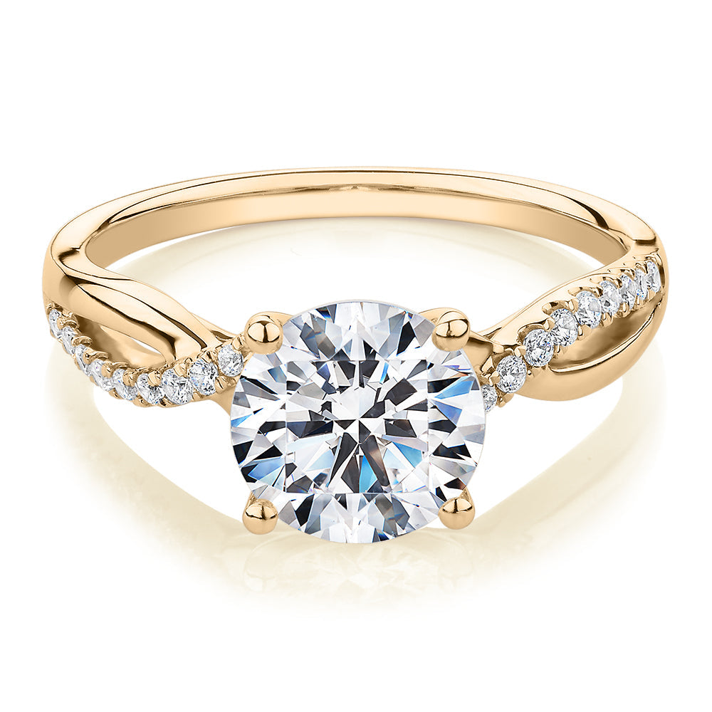 Round Brilliant shouldered engagement ring with 2.17 carats* of diamond simulants in 14 carat yellow gold