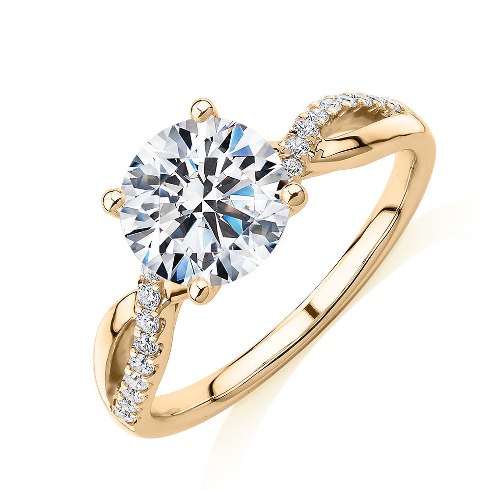Round Brilliant shouldered engagement ring with 2.17 carats* of diamond simulants in 14 carat yellow gold