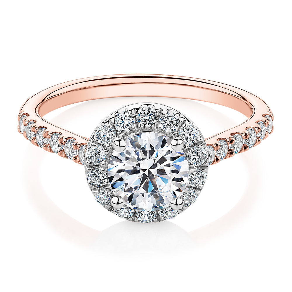 Round Brilliant halo engagement ring with 1.61 carats* of diamond simulants in 14 carat rose and white gold