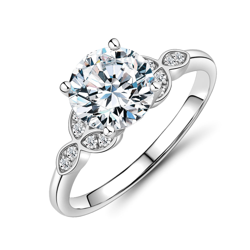 Round Brilliant shouldered engagement ring with 2.16 carats* of diamond simulants in 14 carat white gold