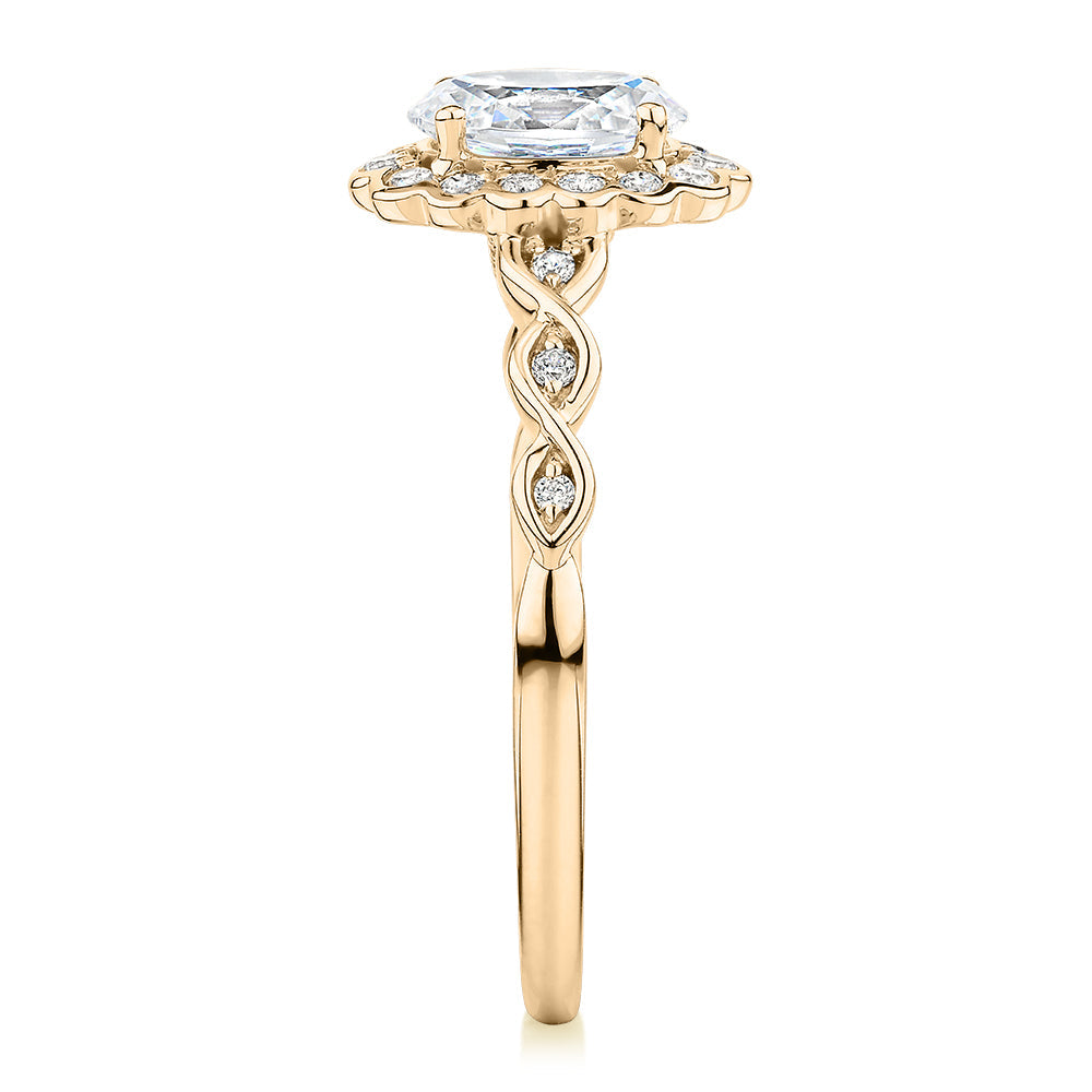 Oval and Round Brilliant halo engagement ring with 0.97 carats* of diamond simulants in 10 carat yellow gold
