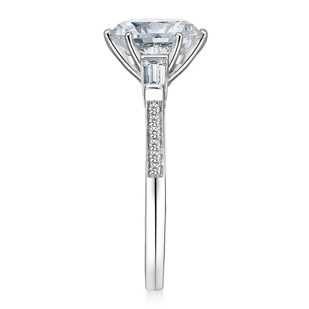 Round Brilliant and Baguette shouldered engagement ring with 3.23 carats* of diamond simulants in 14 carat white gold