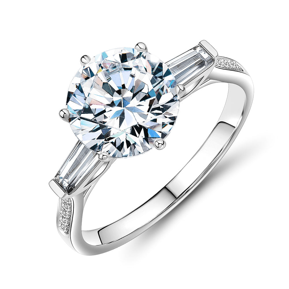 Round Brilliant and Baguette shouldered engagement ring with 3.23 carats* of diamond simulants in 14 carat white gold
