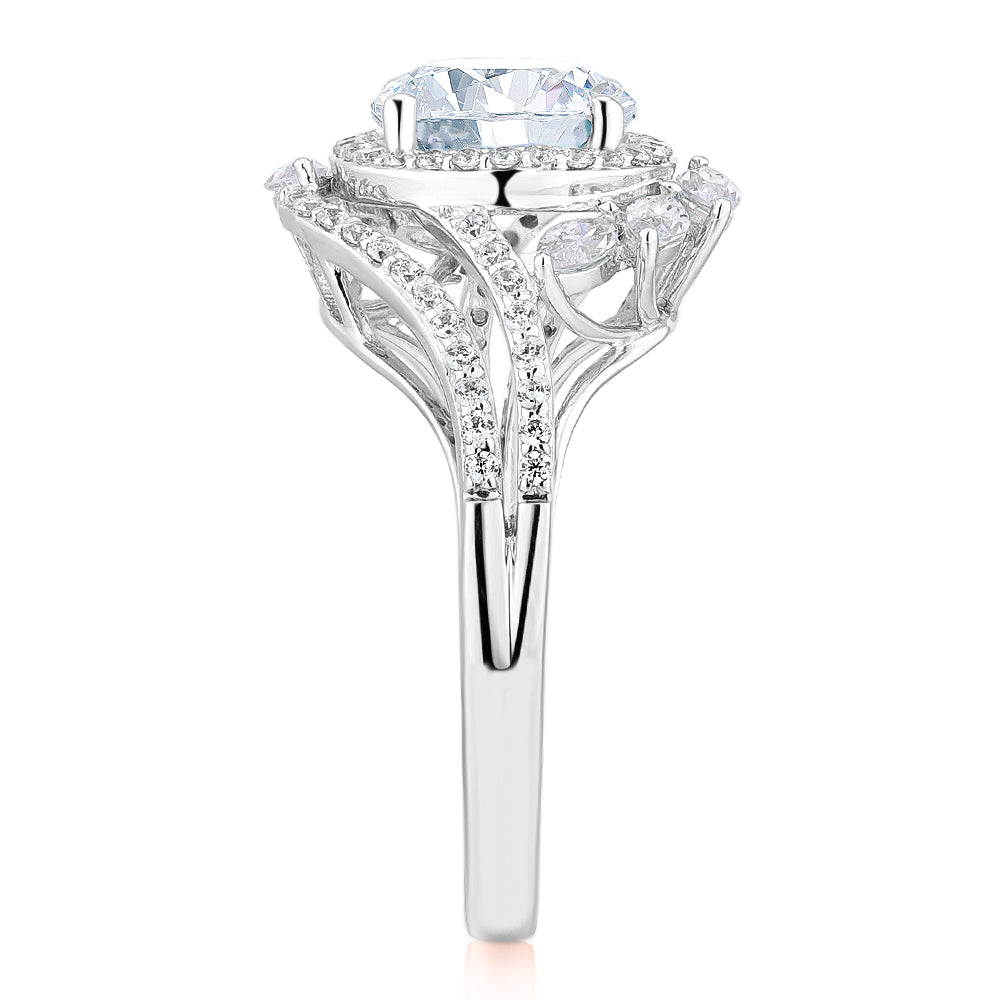 Round Brilliant halo engagement ring with 2.97 carats* of diamond simulants in 14 carat white gold