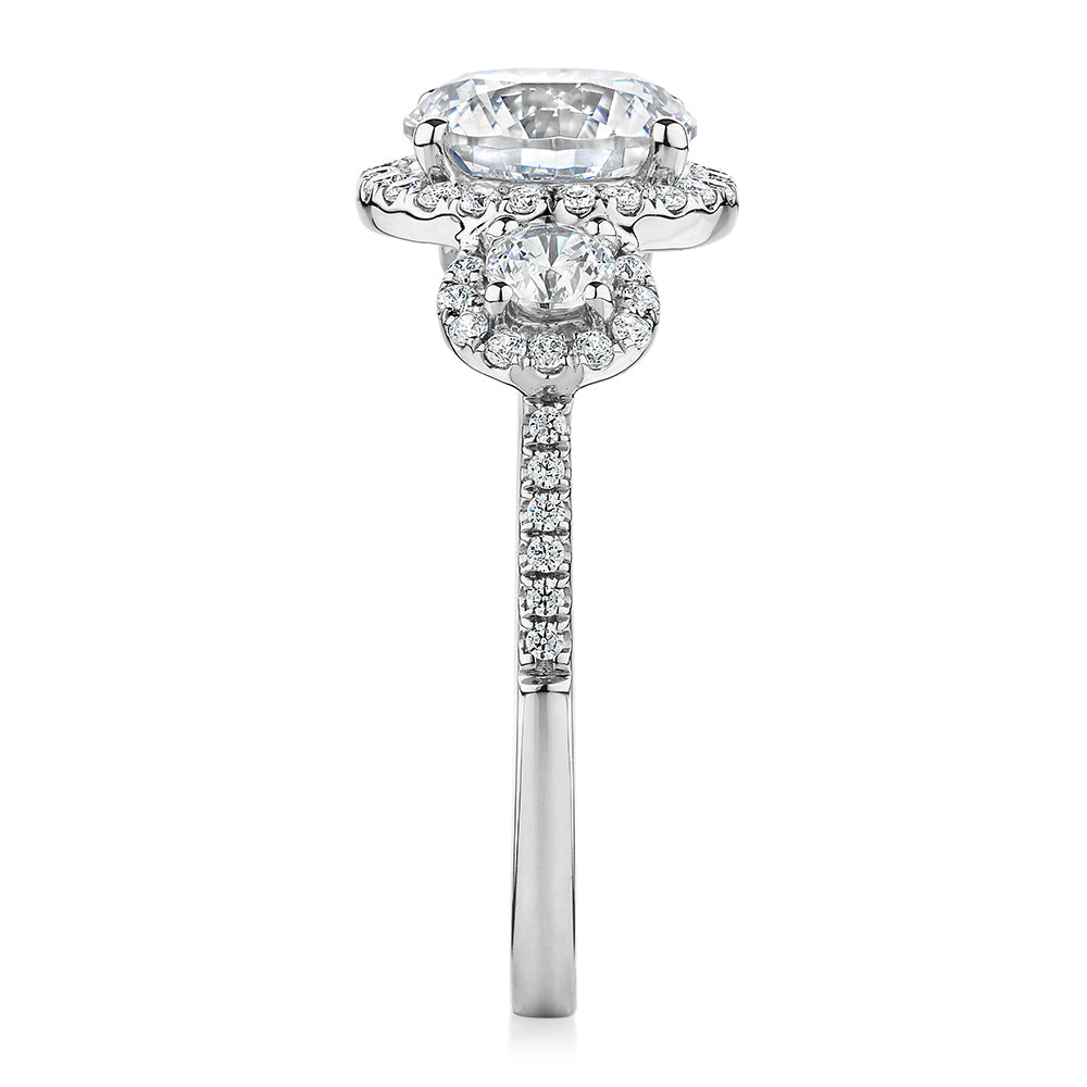 Three stone ring with 2.68 carats* of diamond simulants in 10 carat white gold
