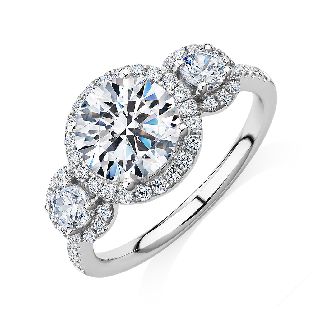 Three stone ring with 2.68 carats* of diamond simulants in 10 carat white gold
