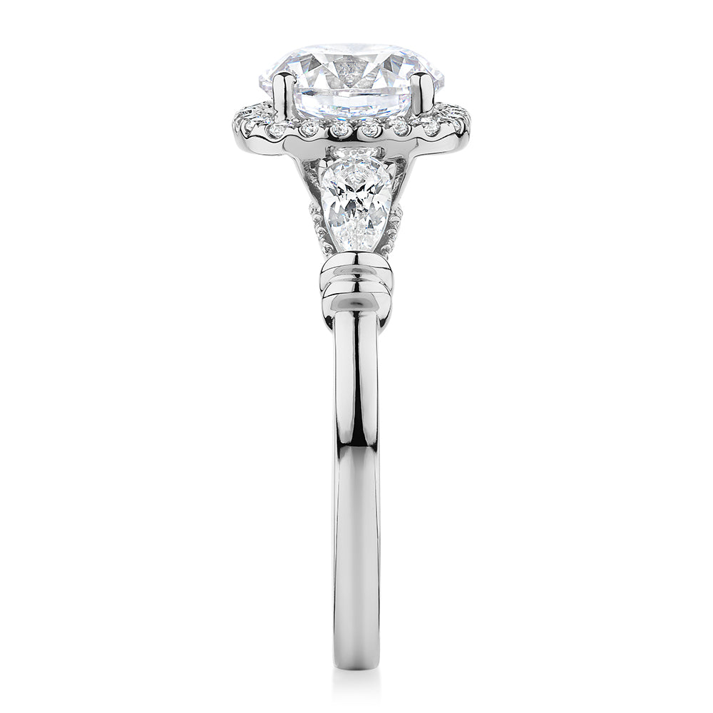 Round Brilliant halo engagement ring with 2.78 carats* of diamond simulants in 14 carat white gold