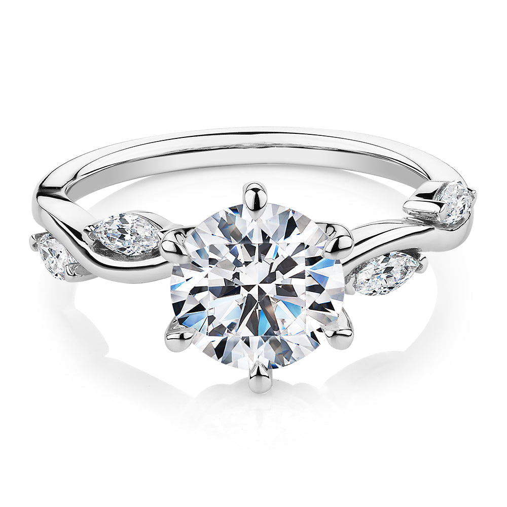 Round Brilliant and Marquise shouldered engagement ring with 2.44 carats* of diamond simulants in 14 carat white gold