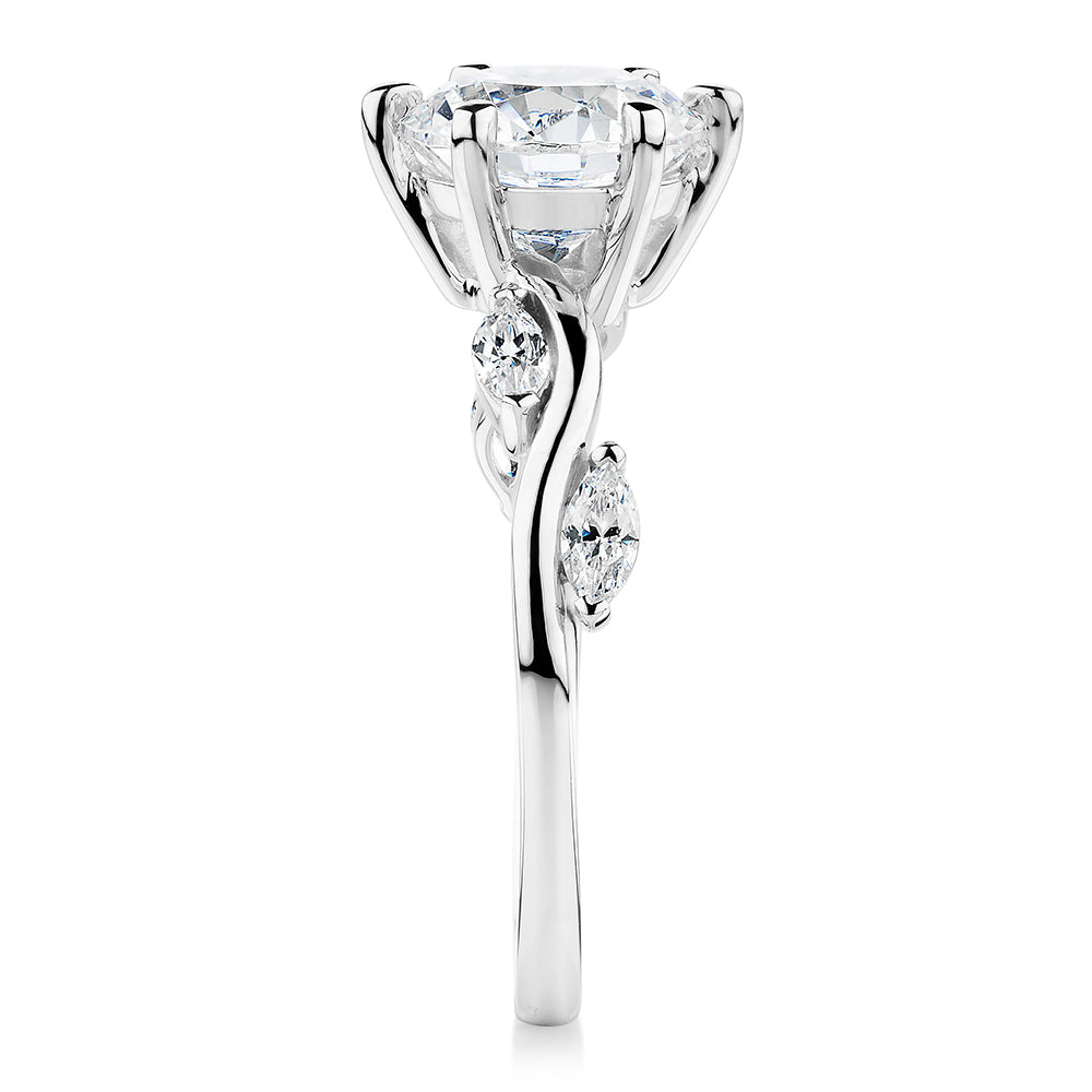 Round Brilliant and Marquise shouldered engagement ring with 2.44 carats* of diamond simulants in 14 carat white gold
