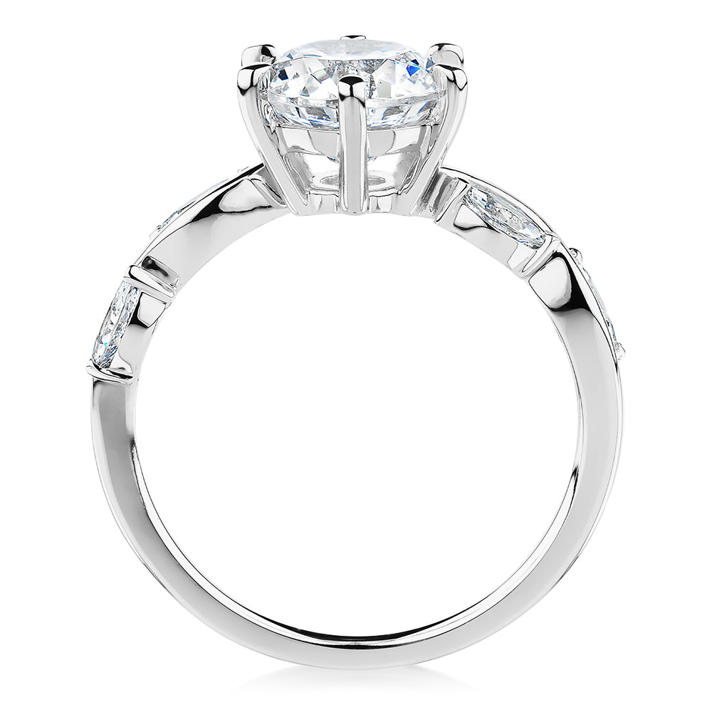 Round Brilliant and Marquise shouldered engagement ring with 2.44 carats* of diamond simulants in 14 carat white gold