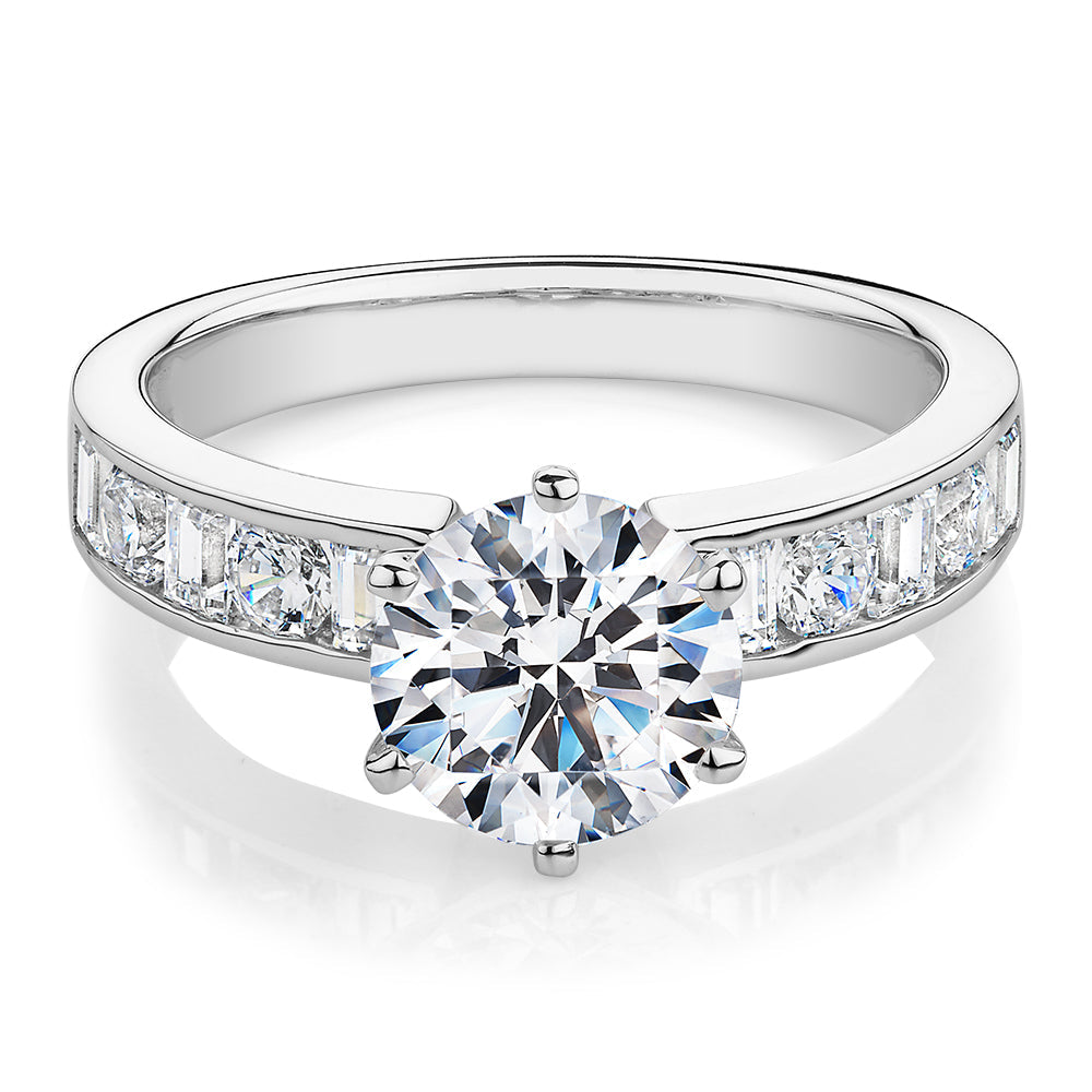 Round Brilliant and Baguette shouldered engagement ring with 2.72 carats* of diamond simulants in 14 carat white gold