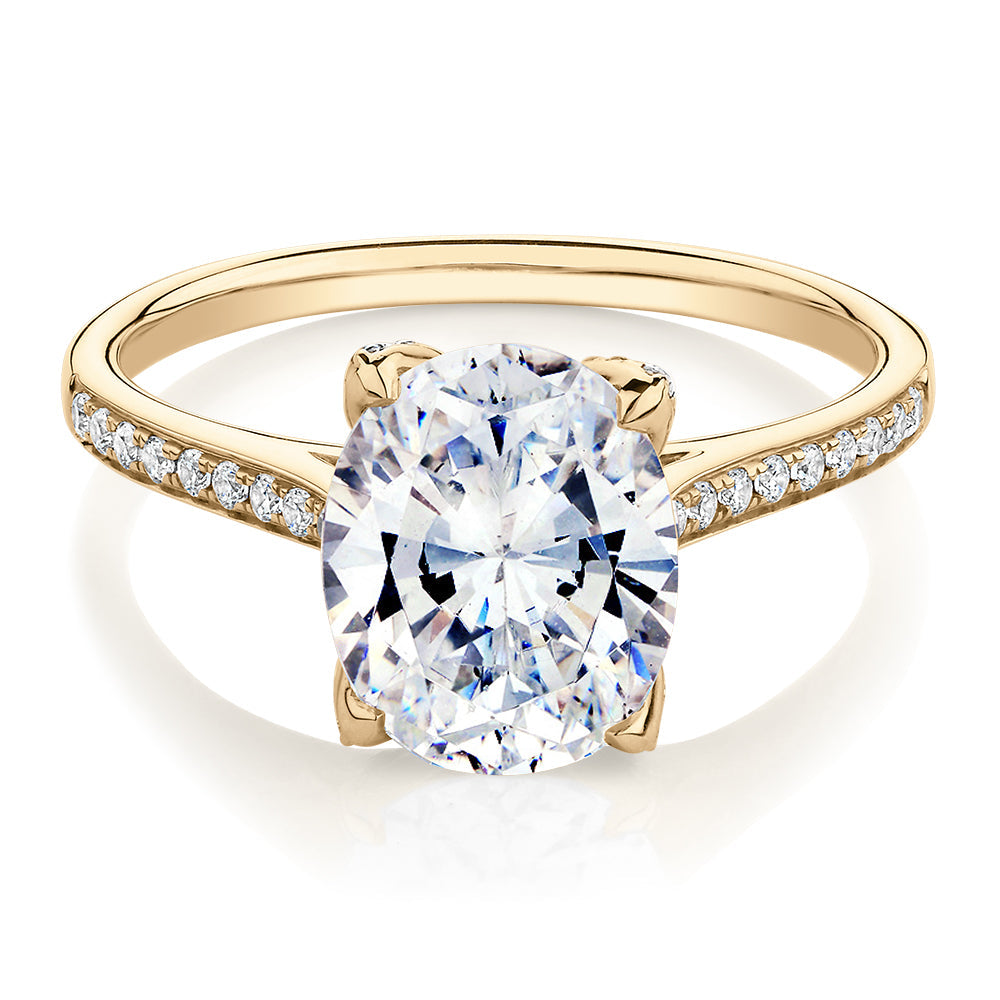 Oval and Round Brilliant shouldered engagement ring with 2.83 carats* of diamond simulants in 14 carat yellow gold