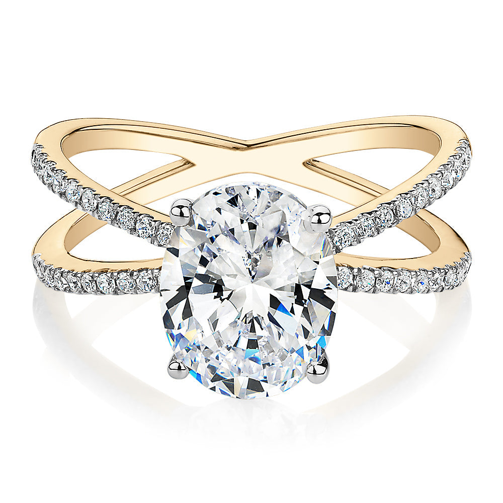 Oval and Round Brilliant shouldered engagement ring with 2.76 carats* of diamond simulants in 14 carat yellow and white gold