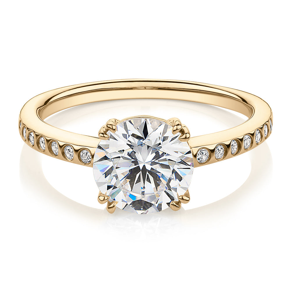 Round Brilliant shouldered engagement ring with 2.17 carats* of diamond simulants in 14 carat yellow gold