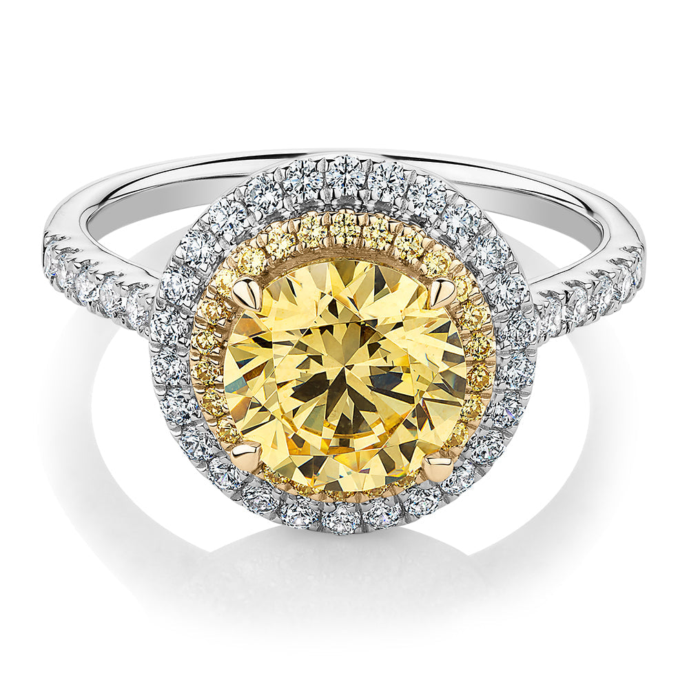 Round Brilliant halo engagement ring with 2.55 carats* of diamond simulants in 10 carat white and yellow gold