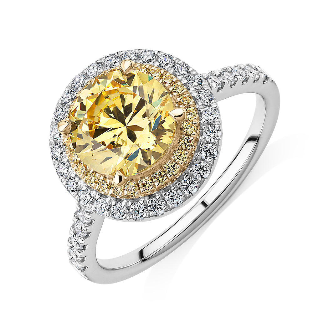 Round Brilliant halo engagement ring with 2.55 carats* of diamond simulants in 10 carat white and yellow gold