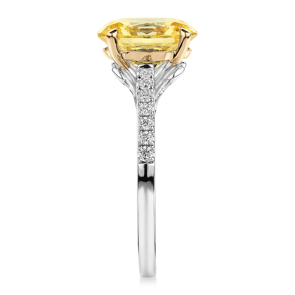 Oval and Round Brilliant shouldered engagement ring with 2.68 carats* of diamond simulants in 10 carat white and yellow gold