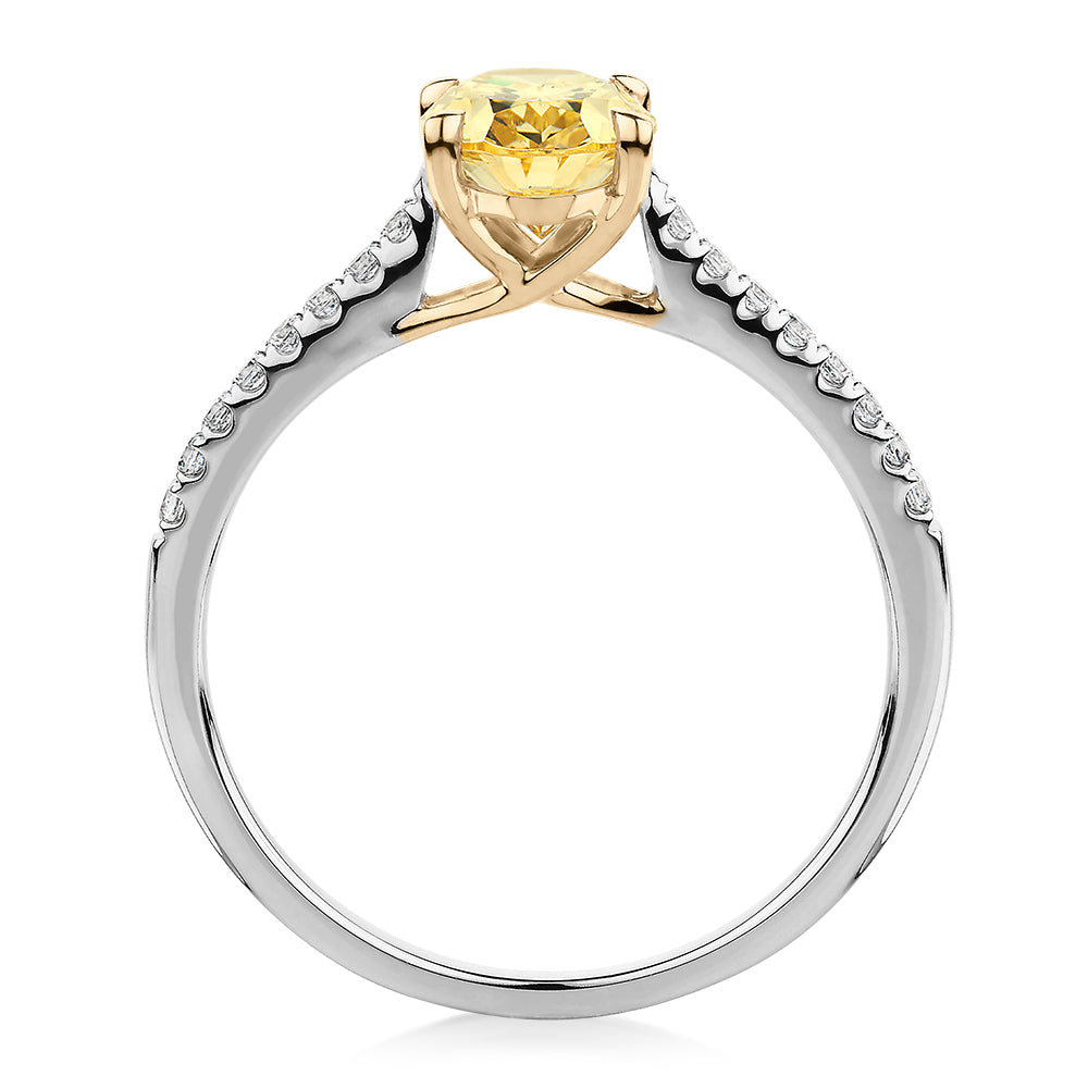 Oval and Round Brilliant shouldered engagement ring with 1.35 carats* of diamond simulants in 10 carat white and yellow gold