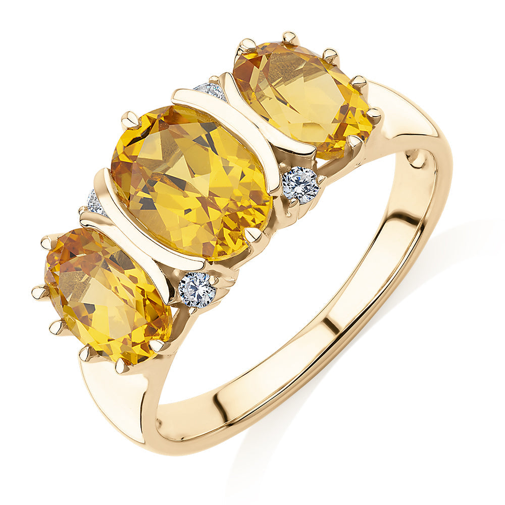 Dress ring with citrine and diamond simulants in 10 carat yellow gold