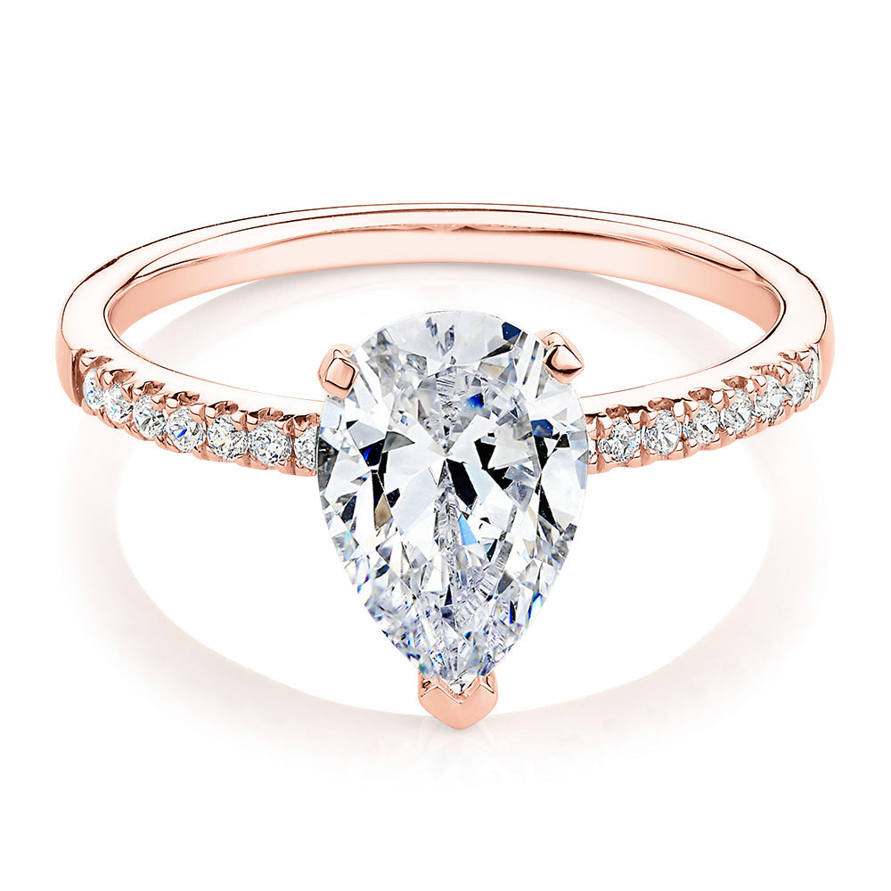 Pear and Round Brilliant shouldered engagement ring with 1.88 carats* of diamond simulants in 14 carat rose gold