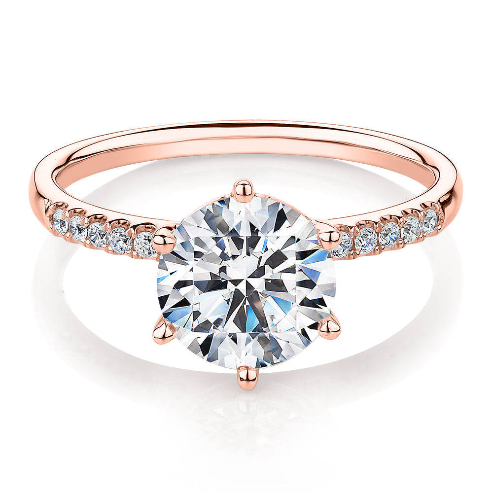 Round Brilliant shouldered engagement ring with 2.12 carats* of diamond simulants in 14 carat rose gold