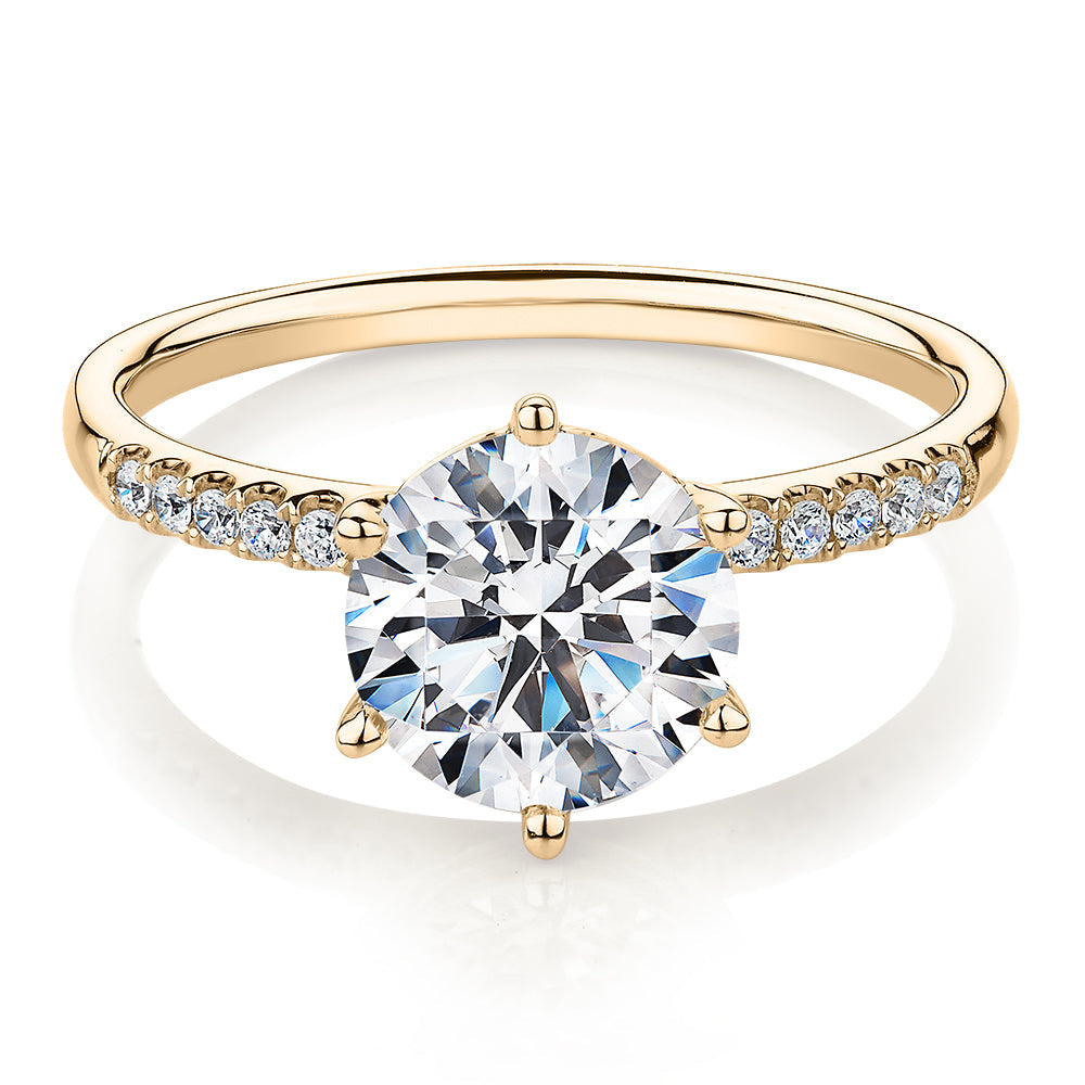 Round Brilliant shouldered engagement ring with 2.12 carats* of diamond simulants in 14 carat yellow gold