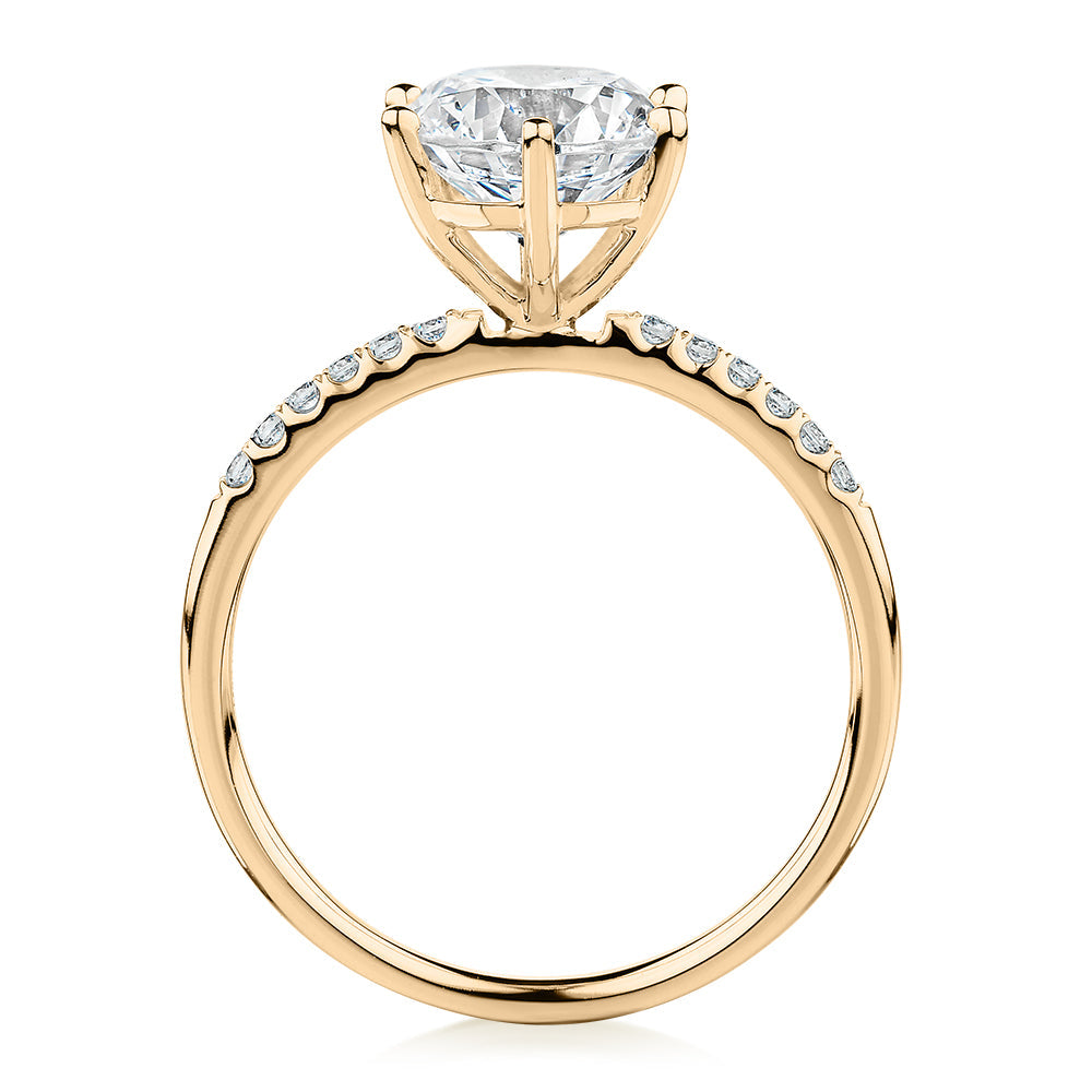 Round Brilliant shouldered engagement ring with 2.12 carats* of diamond simulants in 14 carat yellow gold