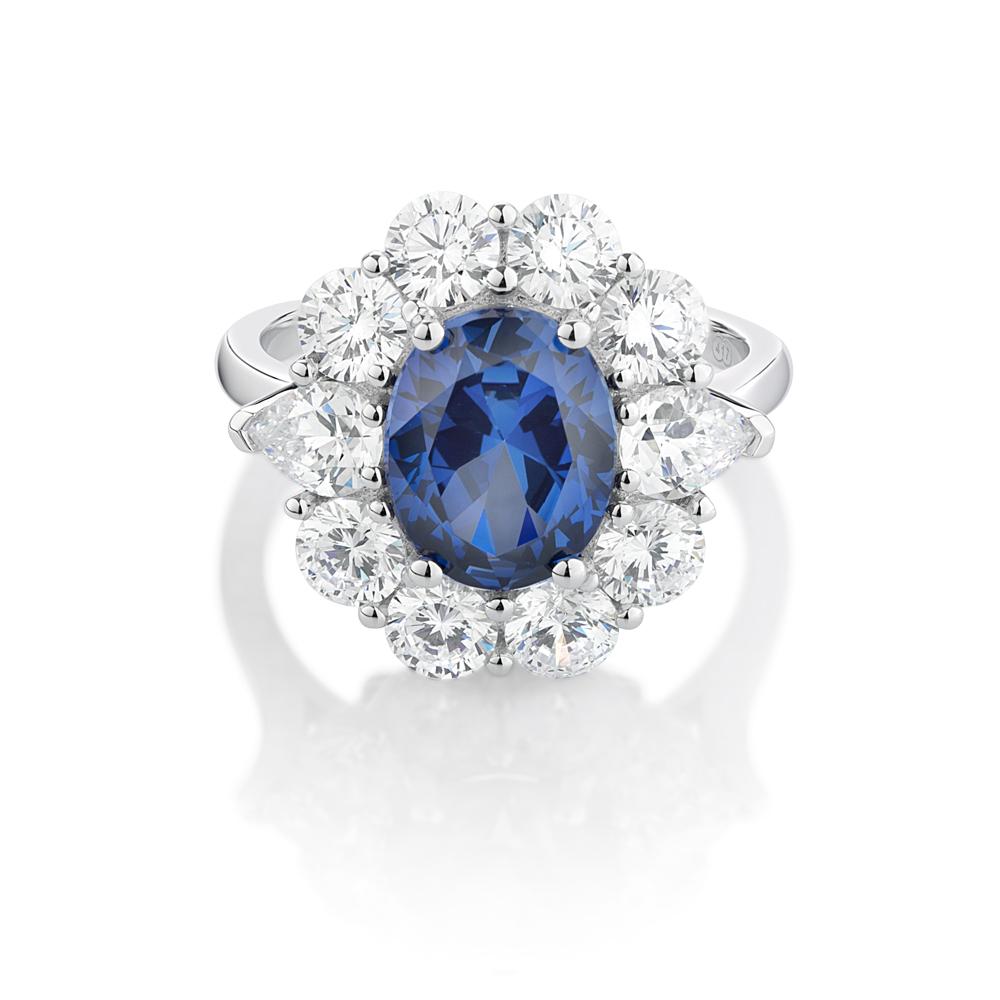 Dress ring with 10x8mm ceylon sapphire simulant and 2.7 carats* of diamond simulants in 10 carat white gold