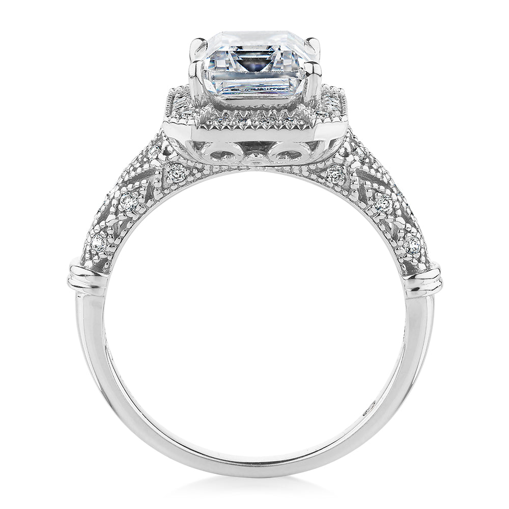 Emerald Cut and Round Brilliant halo engagement ring with 2.9 carats* of diamond simulants in 10 carat white gold
