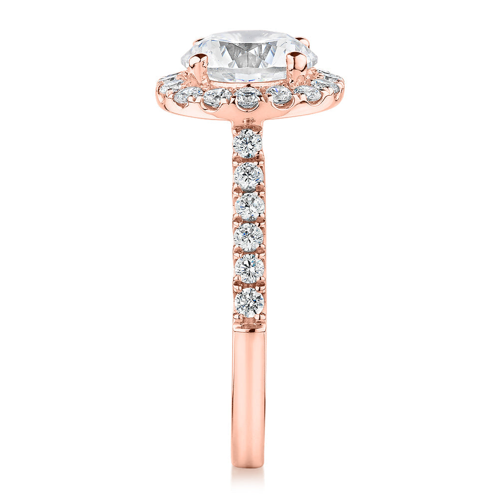 Round Brilliant halo engagement ring with 2.46 carats* of diamond simulants in 10 carat rose gold