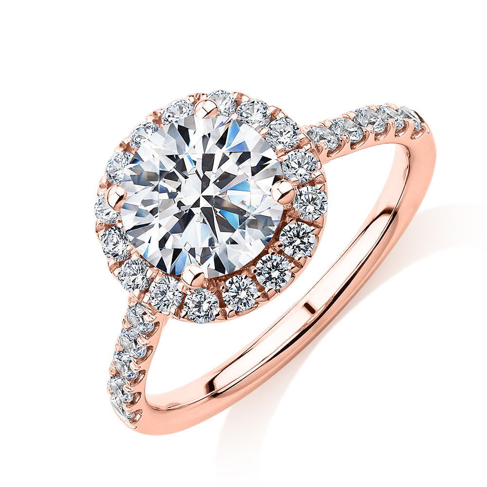 Round Brilliant halo engagement ring with 2.46 carats* of diamond simulants in 10 carat rose gold