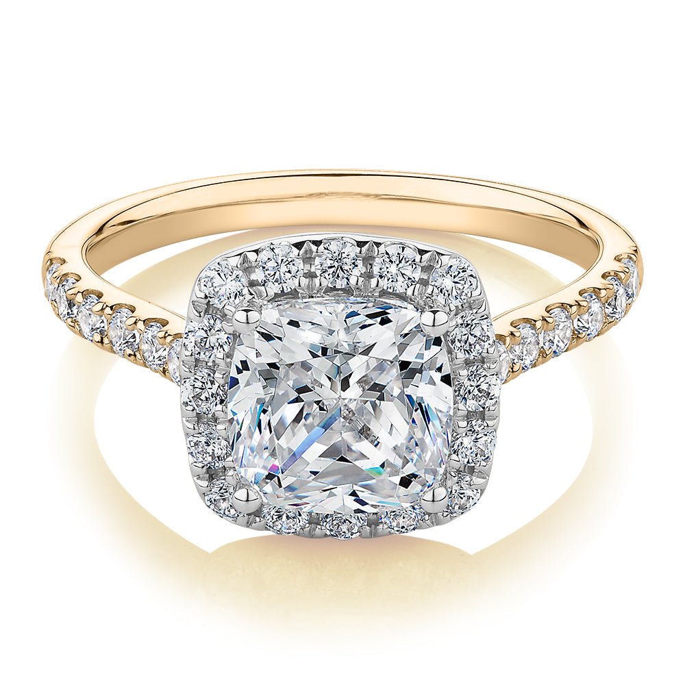 Cushion and Round Brilliant halo engagement ring with 2.09 carats* of diamond simulants in 10 carat yellow and white gold