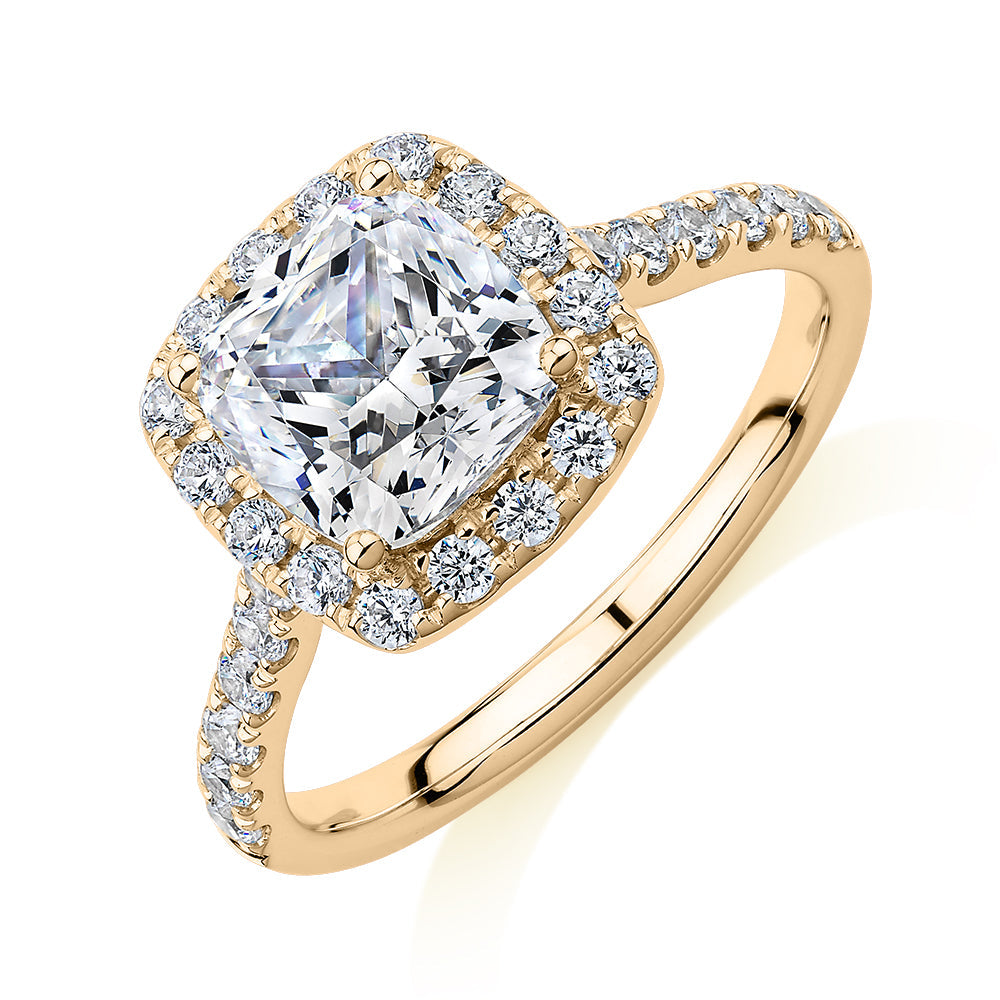 Cushion and Round Brilliant halo engagement ring with 2.09 carats* of diamond simulants in 10 carat yellow gold
