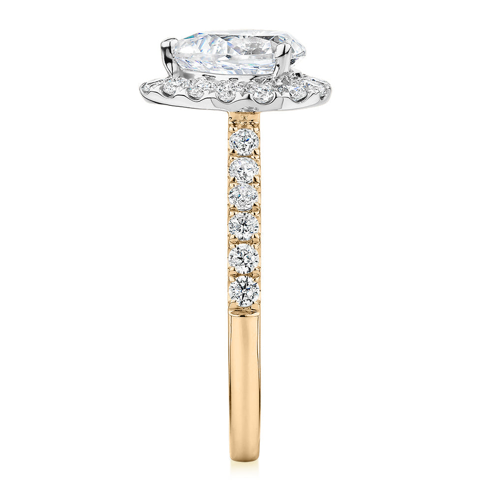 Pear and Round Brilliant halo engagement ring with 1.83 carats* of diamond simulants in 14 carat yellow and white gold